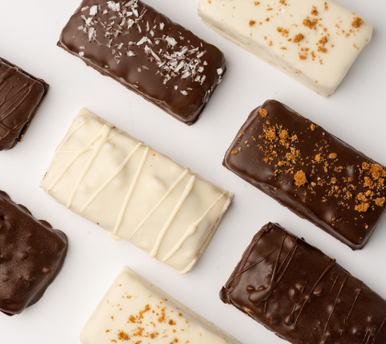 An assortment of Loada Balls protein bars on a white background. 