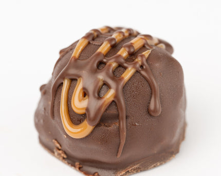 Loada Balls Caramel protein ball close up product render on a white background.