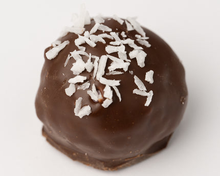 A single Loada Balls Coconut protein ball close up product render on a white background.