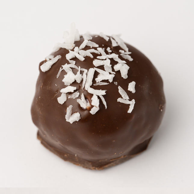 A single Loada Balls Coconut protein ball close up product render on a white background.