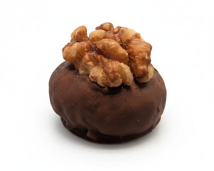 A close up of the Nutty Crunch Protein Ball from Loada Balls.