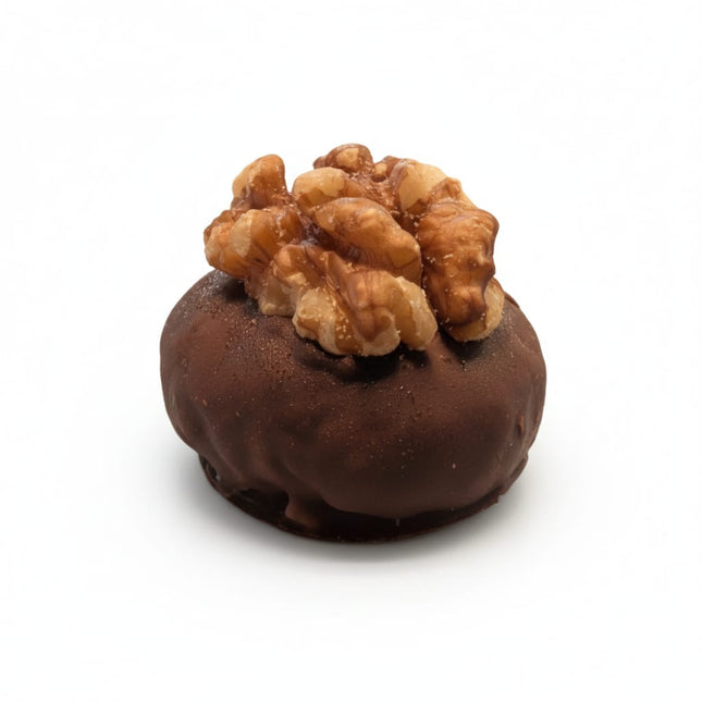 A close up of the Nutty Crunch Protein Ball from Loada Balls.