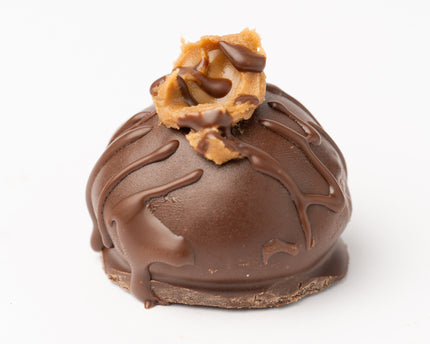 Loada Balls Peanut butter and Caramel Protein ball close up product render on a white background.