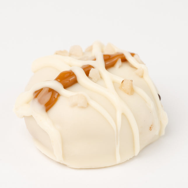 Loada Balls White Peanut Butter and Caramel protein ball close up product render on a white background.