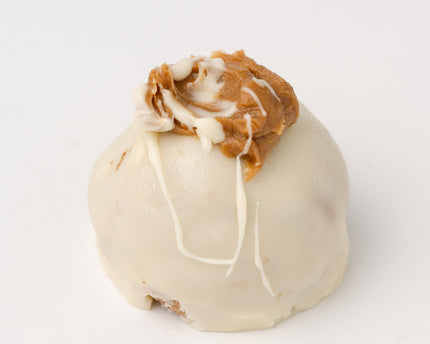 The Loada Balls White Peanutbutter and Caramel protein ball close up product render on a white background.